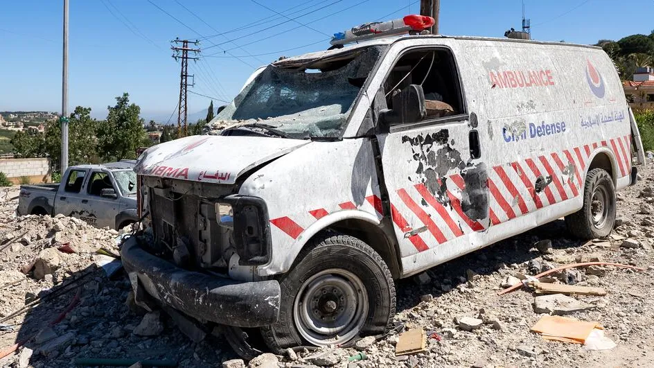 A damaged, non-operational ambulance stands near destroyed buildings on a street heavily affected by the recent hostilities, close to the government hospital in Tibnin, South Lebanon. Tibnin, South Lebanon