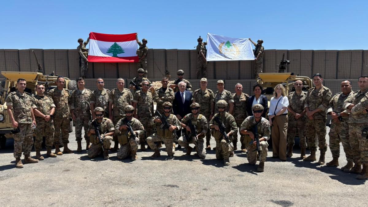 Arnault surrounded by soldiers at Border Regiment 3