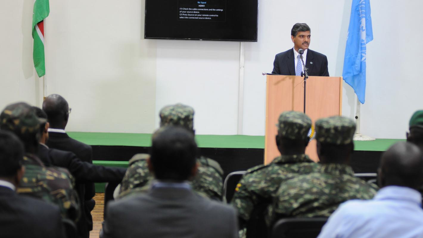 A man stands at a podium