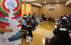 Students watching the VR documentary using headsets and controllers.